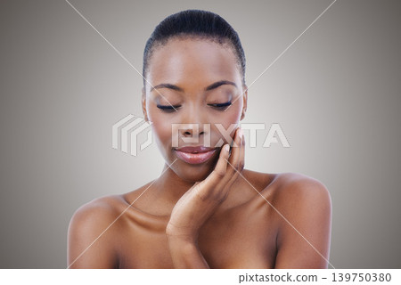 Woman, skincare and natural wellness in studio for healthy cosmetics for dermatology, beauty or grey background. Black person, model and thinking in Kenya or glowing makeup, treatment or mockup space Woman, skincare and natural wellness in studio for healthy cosmetics for dermatology, beauty or grey background. Black person, model and thinking in Kenya or glowing makeup, treatment or mockup space 139750380