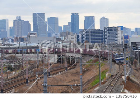 Follow the northern freight line against the backdrop of the skyscrapers of Osaka Follow the northern freight line against the backdrop of the skyscrapers of Osaka 139750410