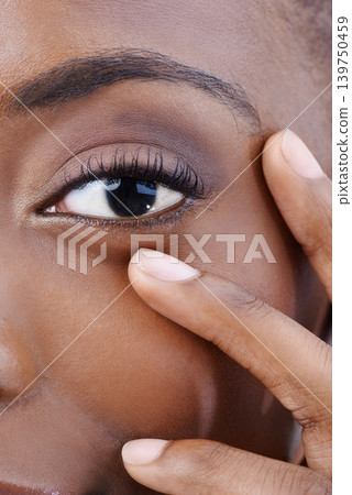 Closeup, eye and black woman with beauty, vision and skincare with dermatology. Half, portrait and African model with natural makeup and hand on face with healthy skin from cosmetics or facial 139750459