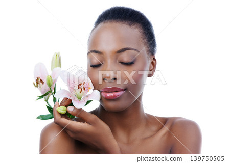 Black woman, flower and natural beauty, dermatology and skincare for glow and wellness on white background. Nature, healthy skin and sustainable cosmetics, face with shine and orchid in a studio Black woman, flower and natural beauty, dermatology and skincare for glow and wellness on white background. Nature, healthy skin and sustainable cosmetics, face with shine and orchid in a studio 139750505