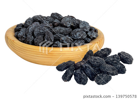 black raisins in wooden bowl isolated on white background 139750578