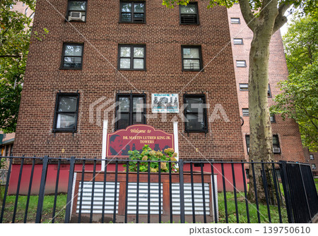 New york, usa august 18,2024. Dr. Martin luther king jr. Towers housing project in harlem, new york city, featuring brick buildings and welcoming signs New york, usa august 18,2024. Dr. Martin luther king jr. Towers housing project in harlem, new york city, featuring brick buildings and welcoming signs 139750610