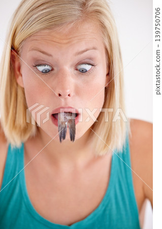 Shocked, woman and eating of fish with surprise on face in white background of studio. Crazy, diet and hungry person with horror at weird seafood, cuisine and disgust in mouth for gross food Shocked, woman and eating of fish with surprise on face in white background of studio. Crazy, diet and hungry person with horror at weird seafood, cuisine and disgust in mouth for gross food 139750706