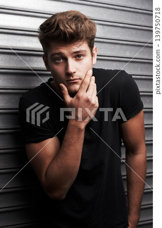 Serious, man and cool portrait with fashion or style on metal background with grunge aesthetic. Confident, person and casual outfit for urban, city and streetwear on wall backdrop in town at night 139750718