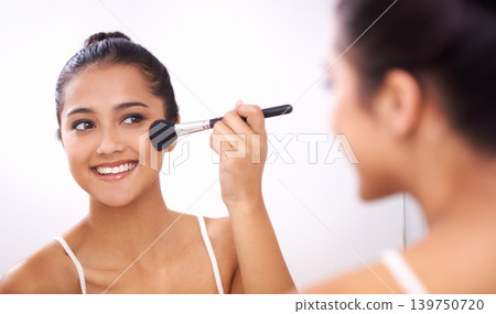 Happy woman, makeup brush and face in mirror for cosmetics, grooming or beauty in bathroom at home. Female person smile and applying foundation, blush or contour for facial treatment in reflection Happy woman, makeup brush and face in mirror for cosmetics, grooming or beauty in bathroom at home. Female person smile and applying foundation, blush or contour for facial treatment in reflection 139750720