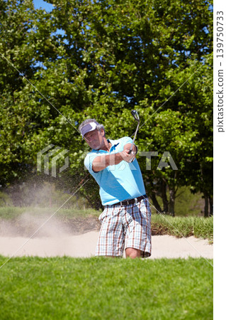 Senior, sand and man playing golf in pit, lawn or green grass or field for sports, swing or shot on course. Mature male person, golfer or player hitting difficult ball for game or point in nature Senior, sand and man playing golf in pit, lawn or green grass or field for sports, swing or shot on course. Mature male person, golfer or player hitting difficult ball for game or point in nature 139750733