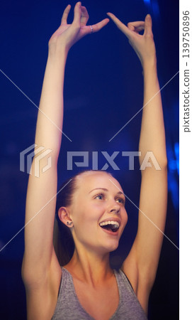 Rock, fan and woman at concert dance in celebration of music, event or festival with energy at night. Person, party and smile in audience with support for metal rave with freedom and happiness Rock, fan and woman at concert dance in celebration of music, event or festival with energy at night. Person, party and smile in audience with support for metal rave with freedom and happiness 139750896