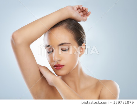 Woman, beauty and makeup with red lipstick for cosmetics on a blue studio background. Young female person or model in relax or satisfaction for cosmetology, dermatology or facial treatment on mockup Woman, beauty and makeup with red lipstick for cosmetics on a blue studio background. Young female person or model in relax or satisfaction for cosmetology, dermatology or facial treatment on mockup 139751079