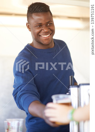 Smile, party and a black man bartender serving drinks outdoor at an event, festival or celebration. Beer, alcohol and carnival with a happy young person at a bar in a tent for beverage service 139751191