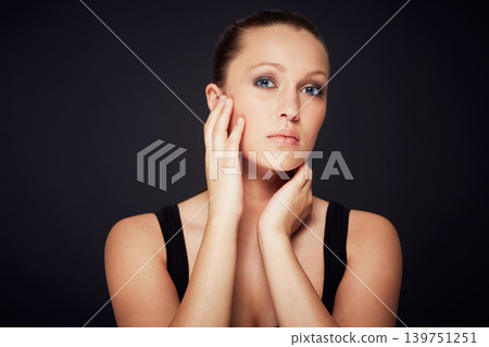 Skincare, portrait and woman in studio for dermatology, shine or wellness treatment on black background. Cosmetic, beauty and female model with hands on face for glowing skin, detox or self care Skincare, portrait and woman in studio for dermatology, shine or wellness treatment on black background. Cosmetic, beauty and female model with hands on face for glowing skin, detox or self care 139751251