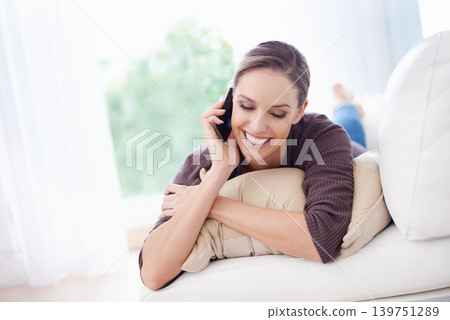 Woman, smile and relax on sofa for phone call, communication and mobile networking at home. Happy lady, smartphone and audio contact for conversation, gossip and chat to digital connection in lounge Woman, smile and relax on sofa for phone call, communication and mobile networking at home. Happy lady, smartphone and audio contact for conversation, gossip and chat to digital connection in lounge 139751289