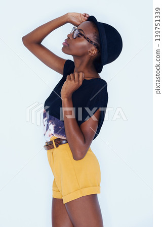 Fashion, glasses and hat with profile of black woman in studio on white background for hipster style. Model, clothes and eyes closed with relaxed young african person in trendy clothing outdoor Fashion, glasses and hat with profile of black woman in studio on white background for hipster style. Model, clothes and eyes closed with relaxed young african person in trendy clothing outdoor 139751339