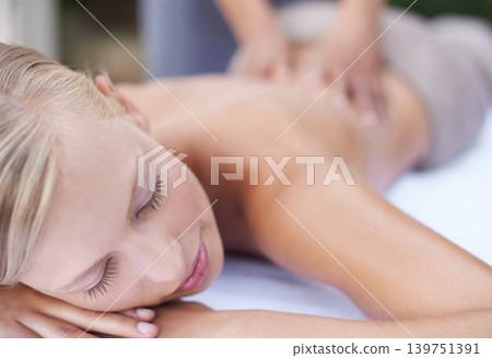 Woman, massage therapist and spa for treatment, back and sleeping for wellness and stress relief therapy. Face, masseuse and relaxing in resort, peaceful and hands for luxury body care or tranquility Woman, massage therapist and spa for treatment, back and sleeping for wellness and stress relief therapy. Face, masseuse and relaxing in resort, peaceful and hands for luxury body care or tranquility 139751391