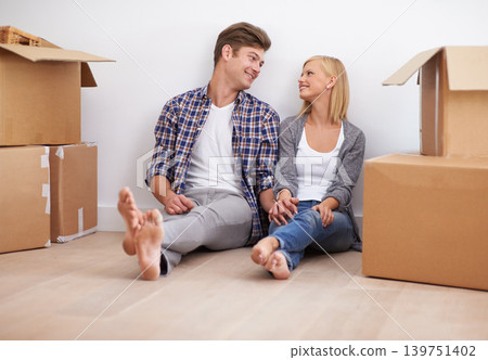 Couple, moving and new home with boxes for packing, real estate and happy holding hands for support. Property, achievement or investment with people and cardboard for relocation, mortgage or rent Couple, moving and new home with boxes for packing, real estate and happy holding hands for support. Property, achievement or investment with people and cardboard for relocation, mortgage or rent 139751402