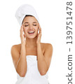 Towel, beauty studio and woman happy for morning routine, self care treatment or feeling collagen results. Bathroom, eyes closed and girl with skincare, hygiene or clean skin on white background 139751478
