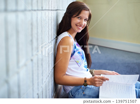 Student, woman and portrait and reading book for education, learning and knowledge in college. Young and smart person with textbook for college research, test or exam script and studying on floor Student, woman and portrait and reading book for education, learning and knowledge in college. Young and smart person with textbook for college research, test or exam script and studying on floor 139751507