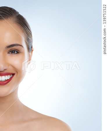 Happy woman, portrait and face with red lipstick for makeup, beauty or cosmetics on a blue studio background. Young female person or model smile for facial treatment in cosmetology on mockup space Happy woman, portrait and face with red lipstick for makeup, beauty or cosmetics on a blue studio background. Young female person or model smile for facial treatment in cosmetology on mockup space 139751522