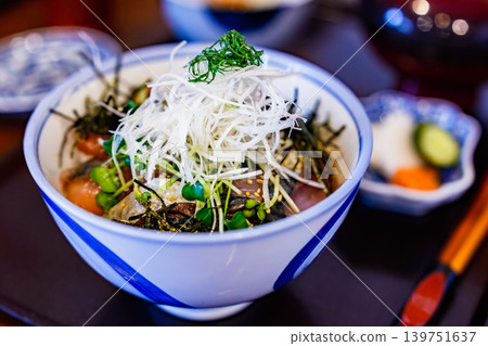 A seafood rice bowl featuring fatty sardines caught during the rainy season. [Seasonal Seafood] 139751637