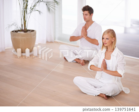 Meditation, prayer and couple on floor for wellness, mindfulness and yogi training in home for calm. Mental health, peace and man and woman for yoga, holistic healing and zen energy in living room Meditation, prayer and couple on floor for wellness, mindfulness and yogi training in home for calm. Mental health, peace and man and woman for yoga, holistic healing and zen energy in living room 139751641