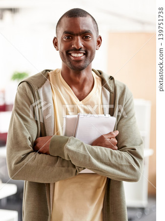 Black man, business worker and portrait in creative agency with writer notes and paperwork at company. Confidence, happy and African male professional ready for working with a smile with arms crossed Black man, business worker and portrait in creative agency with writer notes and paperwork at company. Confidence, happy and African male professional ready for working with a smile with arms crossed 139751738