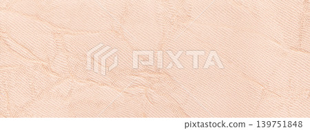 Light peach crumpled textured background from textile material. Wrinkled pastel cream fabric surface, macro Light peach crumpled textured background from textile material. Wrinkled pastel cream fabric surface, macro 139751848