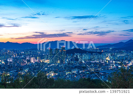 Seoul, South Korea - May. 17, 2026 : Breathtaking evening sky and twilight magic hour over the dense cityscape of Seoul from Yongmasan Mountain, South Korea Seoul, South Korea - May. 17, 2026 : Breathtaking evening sky and twilight magic hour over the dense cityscape of Seoul from Yongmasan Mountain, South Korea 139751921