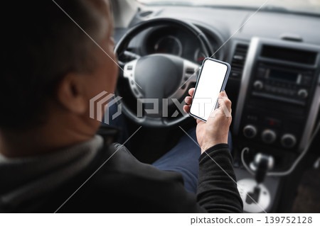 Driver Using Smartphone And Holding Coffee While Driving Car Driver Using Smartphone And Holding Coffee While Driving Car 139752128
