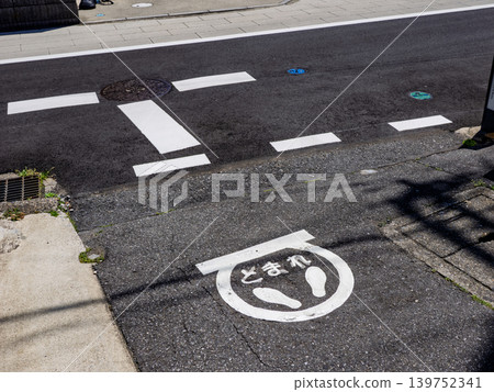 Stop signs with footprints painted on residential streets. Stop signs with footprints painted on residential streets. 139752341