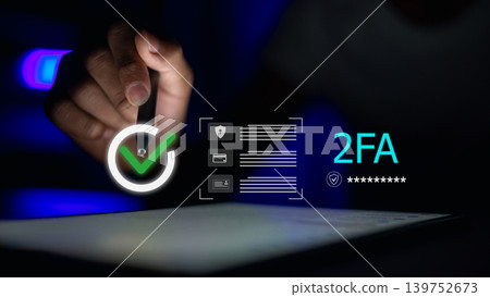 Person using tablet for 2FA two-factor authentication verification. Secure login with check mark icon for digital privacy, data protection, and cyber security concept in dark office. Person using tablet for 2FA two-factor authentication verification. Secure login with check mark icon for digital privacy, data protection, and cyber security concept in dark office. 139752673