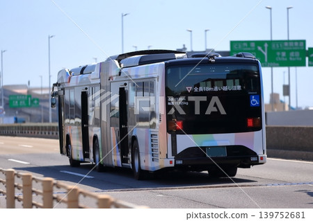 Articulated bus in motion Articulated bus in motion 139752681
