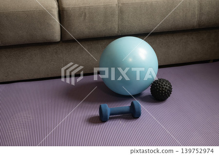 Home workout equipment on yoga mat Home workout equipment on yoga mat 139752974