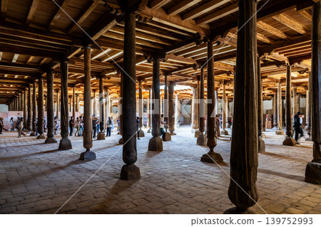 Beautifully carved wooden pillars line the Juma Mosque in Khiva, Uzbekistan. Beautifully carved wooden pillars line the Juma Mosque in Khiva, Uzbekistan. 139752993