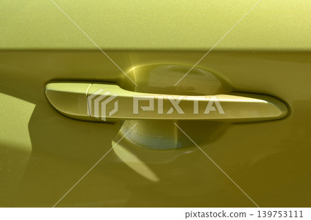 Modern Green Car Door Handle Close Up 139753111