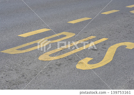 Yellow Bus Lane Marking on Asphalt Road 139753161