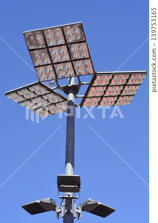 Powerful LED stadium light tower against blue sky Powerful LED stadium light tower against blue sky 139753165