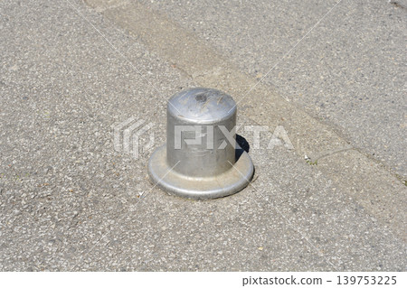 Metal Bollard on Asphalt Street Metal Bollard on Asphalt Street 139753225