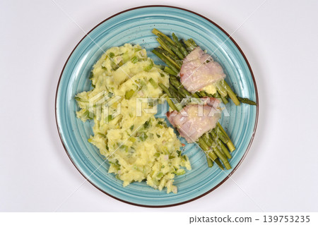 Mashed potatoes with leeks and asparagus wrapped in ham Mashed potatoes with leeks and asparagus wrapped in ham 139753235