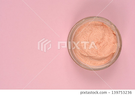 Salmon and fish roe spread in a jar on pink background Salmon and fish roe spread in a jar on pink background 139753236