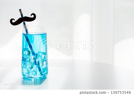 Blue drink with mustache straw celebrating Father's Day Blue drink with mustache straw celebrating Father's Day 139753549