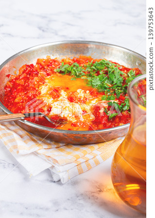 traditional Turkish dish, scrambled eggs with tomatoes, Menemen, with herbs, in a frying pan, close-up, no people, traditional Turkish dish, scrambled eggs with tomatoes, Menemen, with herbs, in a frying pan, close-up, no people, 139753643
