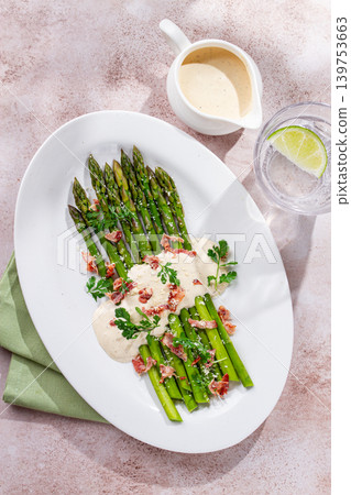 Fresh asparagus with sauce and bacon, on a white plate, sunlight, homemade, no people, Fresh asparagus with sauce and bacon, on a white plate, sunlight, homemade, no people, 139753663