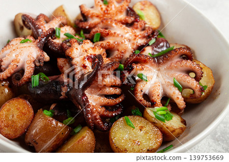 baby grilled octopus with golden baked potatoes and fresh herbs, Maltese cuisine, homemade, no people, 139753669