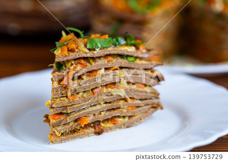 savory liver cake with vegetables and herbs on wooden table 139753729