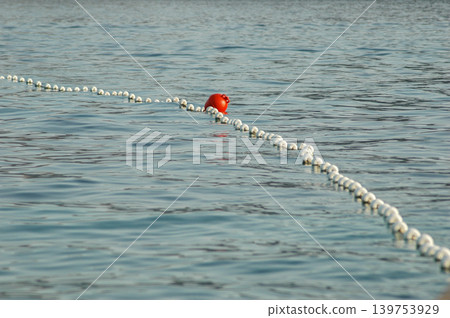 Safety Buoy Line on Sea Water Safety Buoy Line on Sea Water 139753929