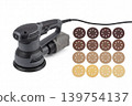Random orbital sander with dust bag and assorted sanding discs isolated on white background. Electric power tool set for woodworking, surface finishing, renovation, repair and workshop use. 139754137
