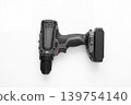 Modern cordless drill driver with battery pack isolated on white background. Versatile power tool for drilling, fastening, repair, renovation, construction, woodworking, and DIY projects. 139754140