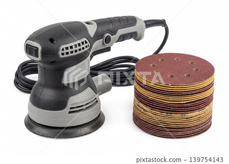 Electric orbital sander with stacked abrasive sanding discs isolated on white background. Professional power tool for woodworking, surface finishing, renovation, repair, and DIY projects. 139754143