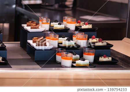 The kitchen aboard the abstract luxury cruise ship. Cakes with blackberry for Dining Room Buffet The kitchen aboard the abstract luxury cruise ship. Cakes with blackberry for Dining Room Buffet 139754233