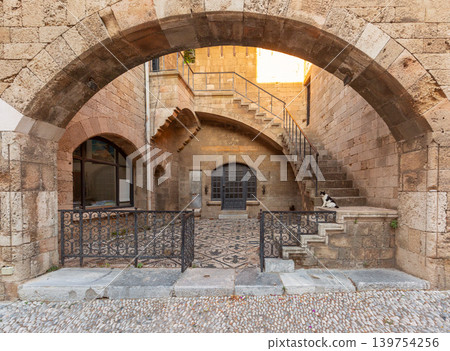 Stone archway and staircase in historic courtyard of Rhodes Old Town Stone archway and staircase in historic courtyard of Rhodes Old Town 139754256
