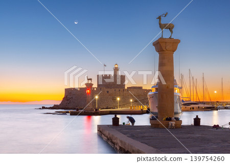 Deer statues and marina harbor at sunrise in Rhodes Old Town Greece 139754260